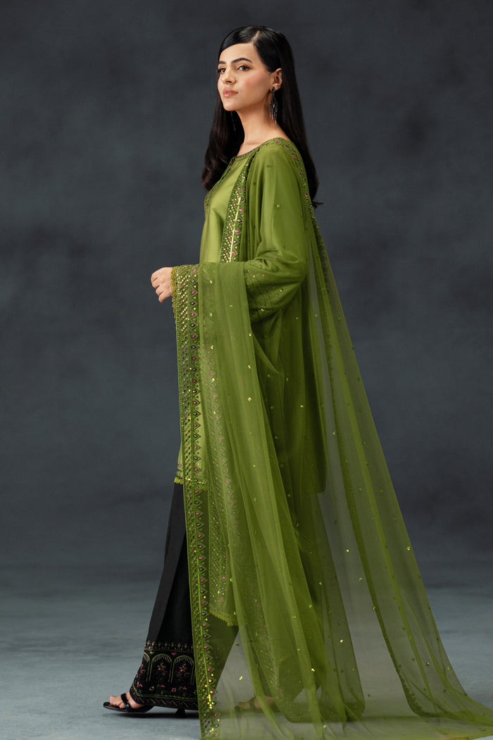 Side view of NAQSHI Abeera ready-to-wear party outfit in lime green with embellished sleeves and coordinated black trousers for celebrations.
