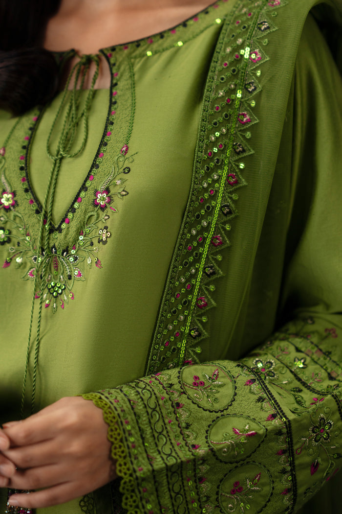 Close up detail of NAQSHI Abeera embroidered pattern and neckline decoration on lime green ready-to-wear dress for event wear.