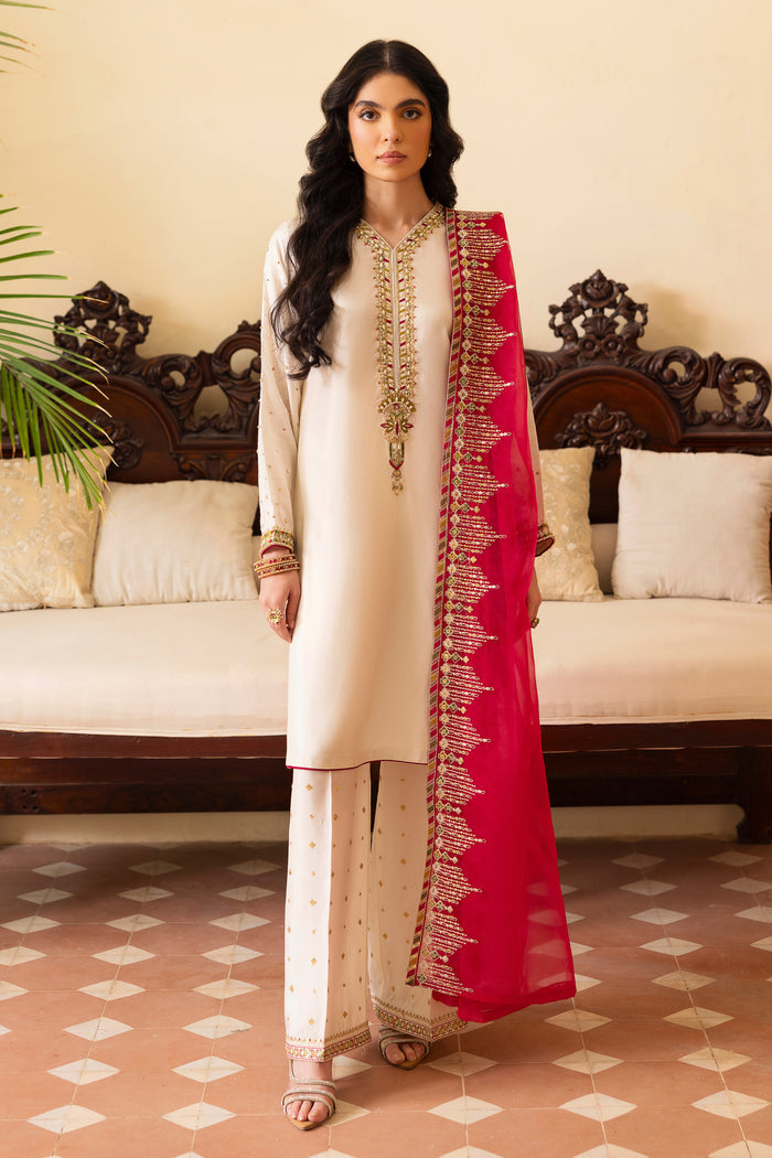 NAQSHI Abish white raw‑silk straight shirt with V‑neck heavily embellished in pure hand‑adda techniques—kora, dabka, naqshi, sitari, cut dana, crystals & stone—and contrasting hot‑pink piping at hem and sleeves, paired with sequin-sprayed clottes.