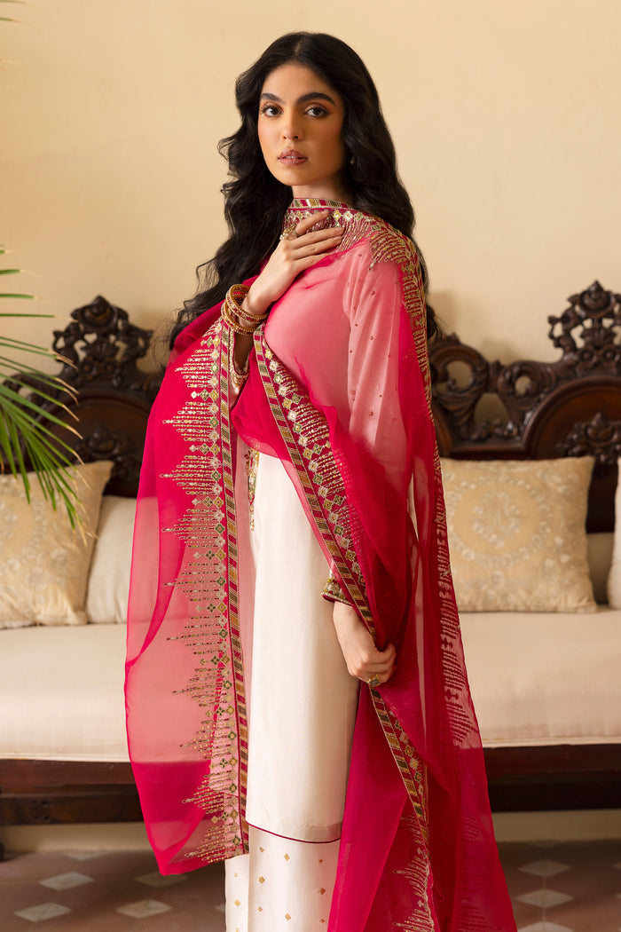 Close-up of NAQSHI Abish V‑neckline highlighting dense hand‑adda embroidery combining kora, dabka, sitari, cut dana, crystals, sheet & stone work against crisp white raw silk.