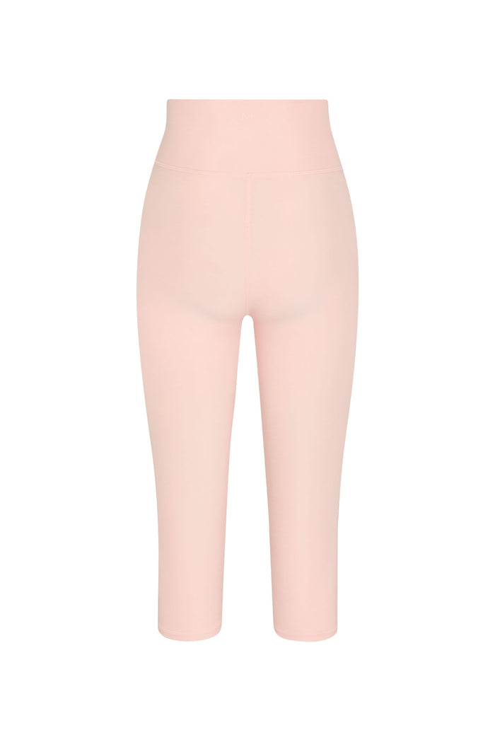 Back view of Acadia cropped legging in Powder Pink showing high waist, double waistband, center back seam and 18in inseam