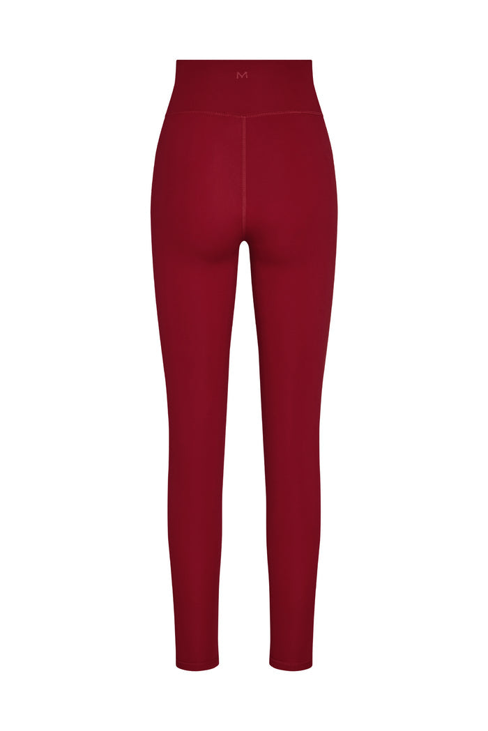 Back view of Acadia Legging in Cherry showing high waistband, center back seam, and fitted leg on white background