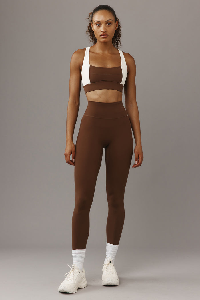 Front view of Acadia Legging 27-inch in Cliffside on model showing high-rise waistband and smooth fitted silhouette on grey background