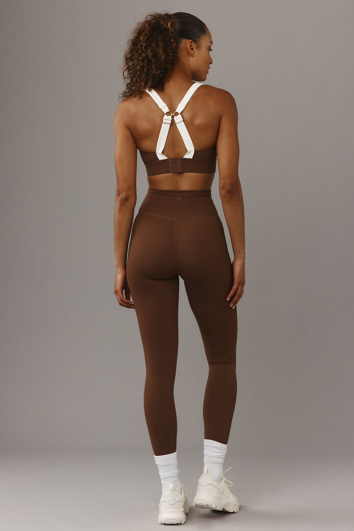Back view of Acadia Legging 27-inch in Cliffside with high-rise waistband and rear seam shaping on grey background