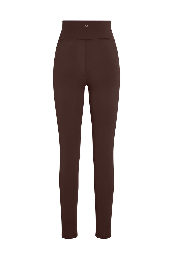 Front view of Acadia Legging 27 inch in Espresso showcasing high-rise waistband with centered M logo and full-length slim fit on white background