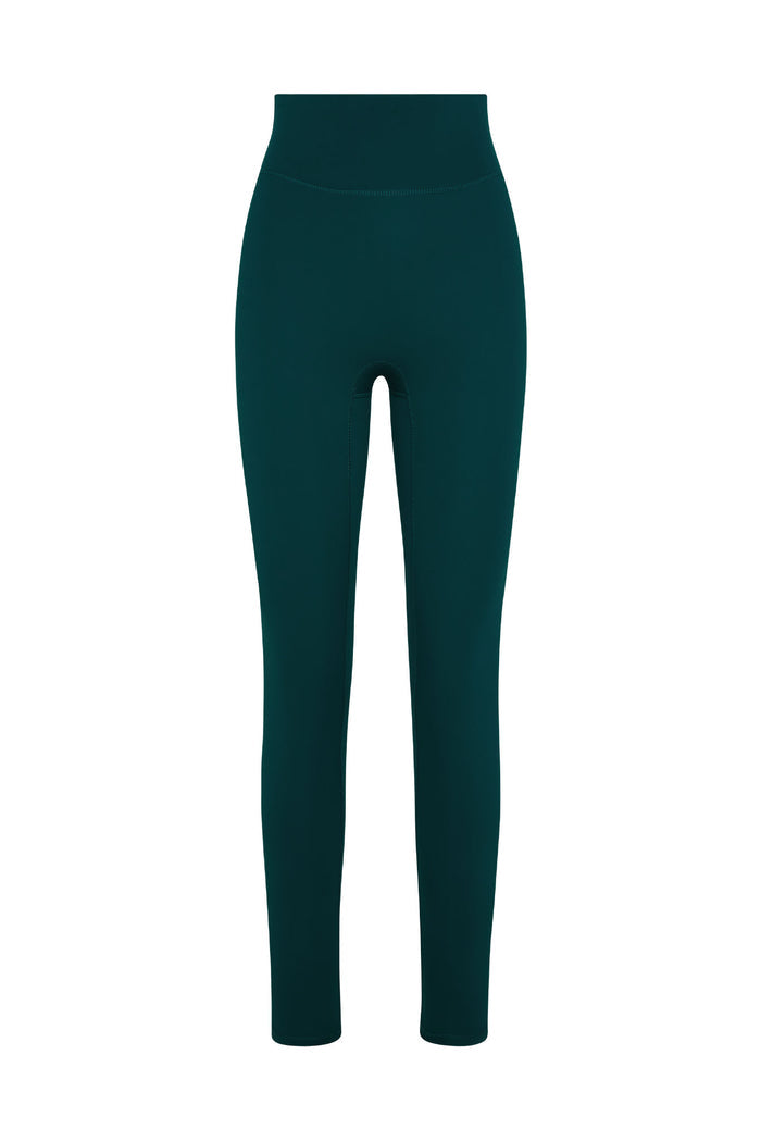 Front of Acadia Legging 27-inch in Evergreen showing high-rise waistband and full-length slim fit on white background