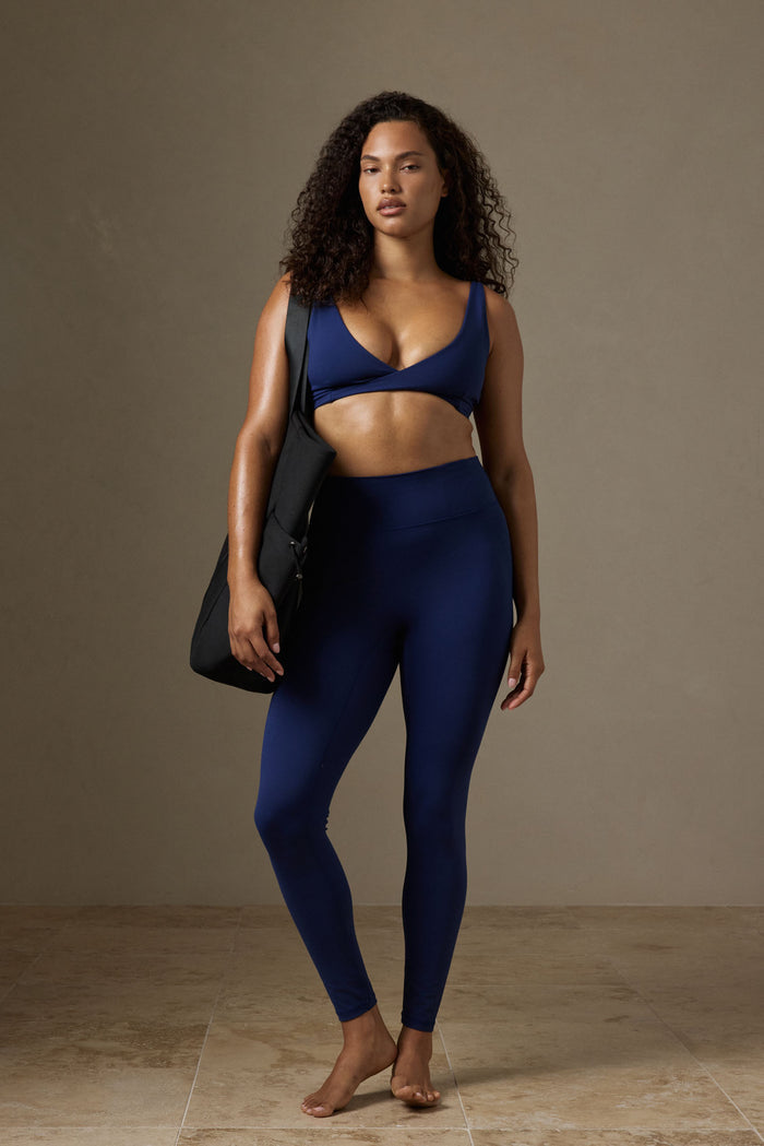 Front view of Acadia Legging 27 inch in Midnight Jersey showing high waist and full-length smooth fit on model, neutral background