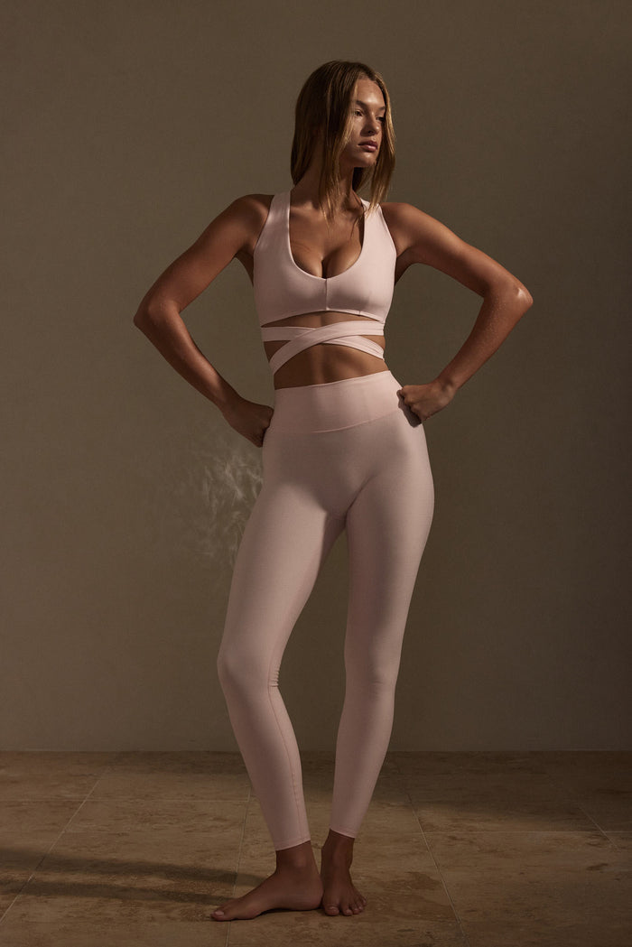 Front view of Acadia Legging Long in Heather Powder Pink showcasing high waist and smooth fitted silhouette on model