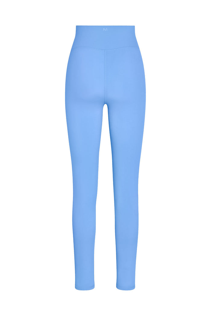 Light blue high-waist leggings, back view, slim fit, small M logo centered on waistband.