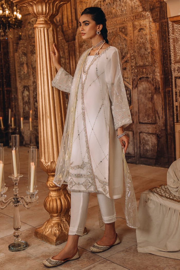 Full front standing view of NAQSHI Afrin outfit showing angrakha cut, A-line shirt, and soft white organza fabric