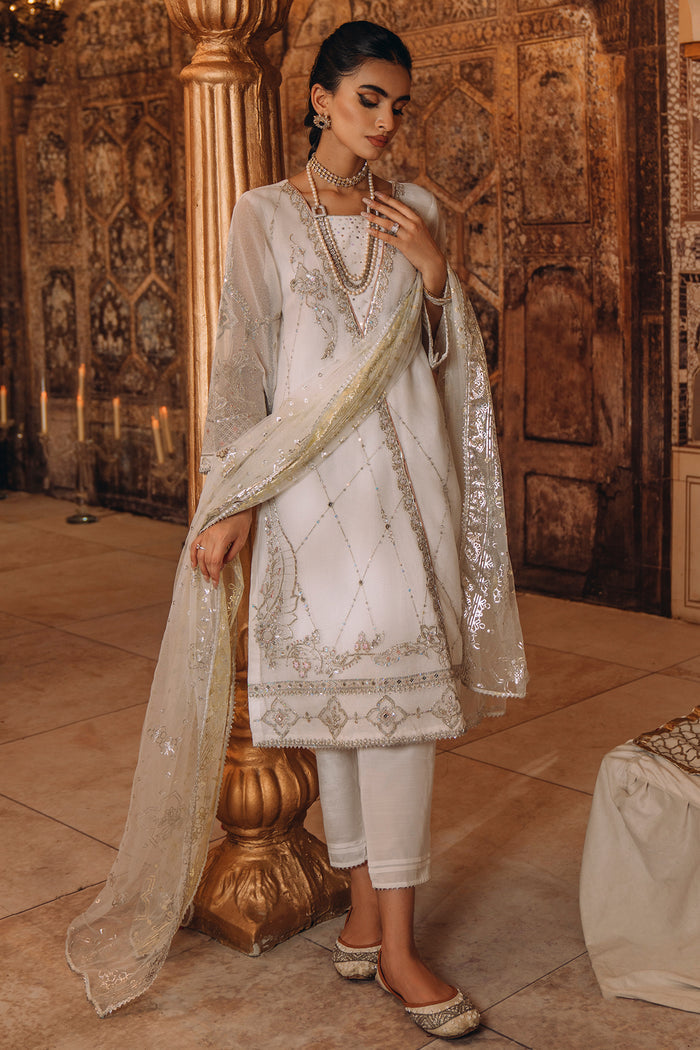 Side angle of NAQSHI Afrin outfit highlighting flowing angrakha style, loose sleeves, and elegant straight pants