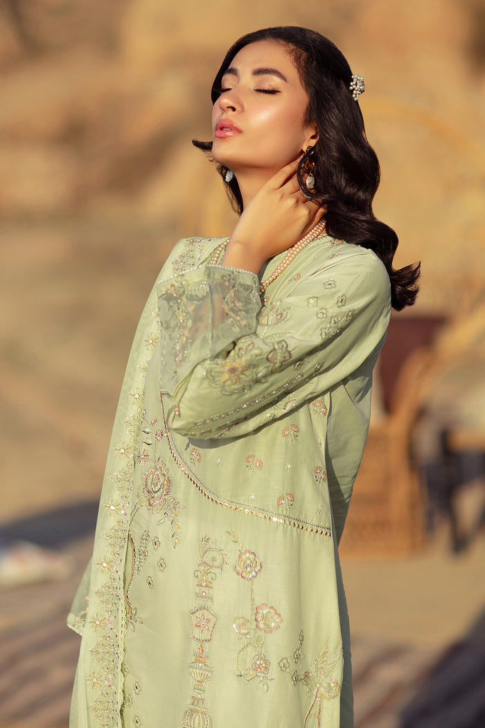 Side pose of NAQSHI Aiza outfit highlighting soft pistachio color, loose sleeves, and graceful shirt fall