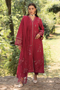 Full standing view of NAQSHI garnet red outfit showing long shirt silhouette and straight trousers