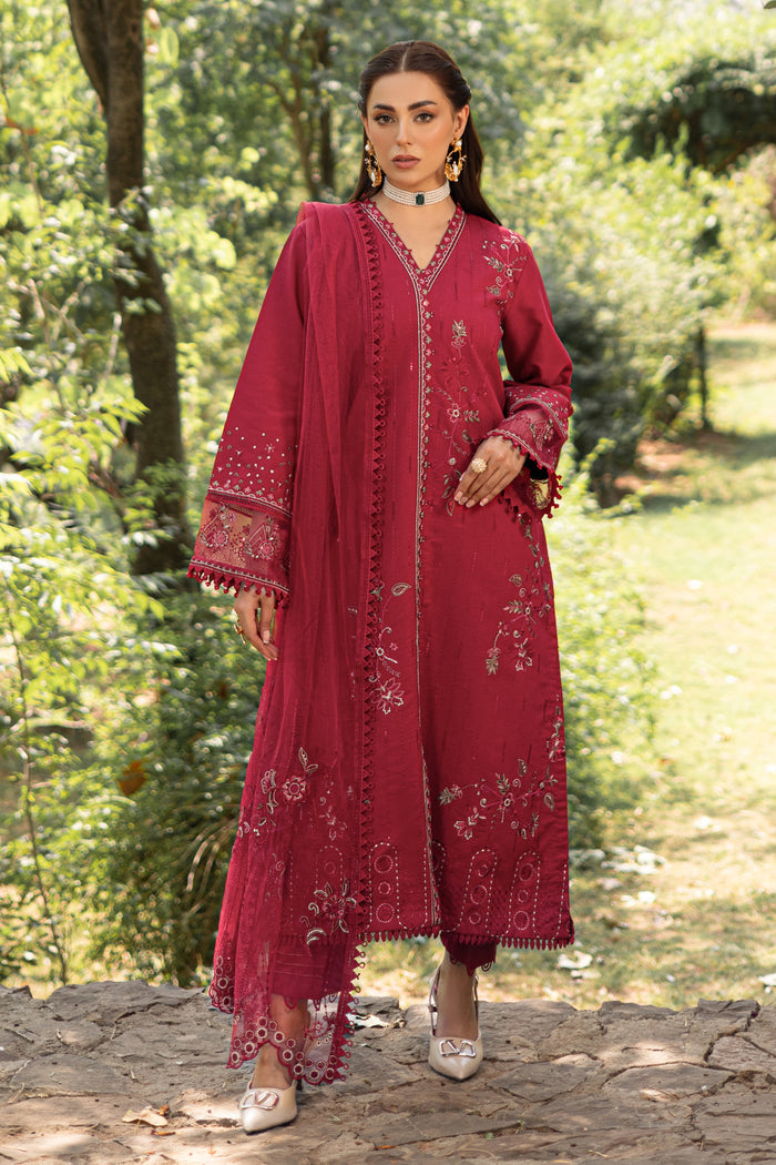 Full standing view of NAQSHI garnet red outfit showing long shirt silhouette and straight trousers
