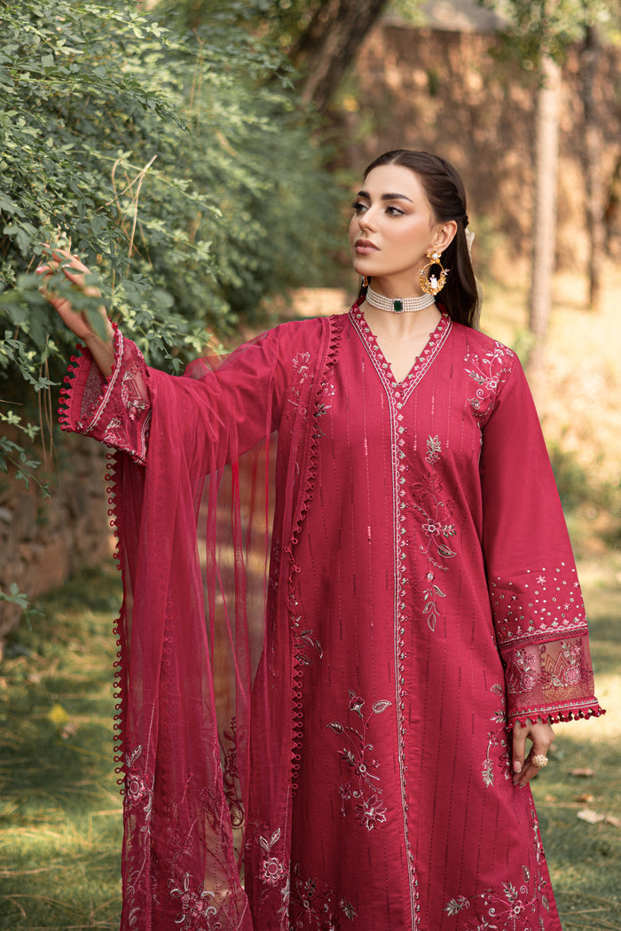 Side styling view of NAQSHI garnet red outfit showing net dupatta drape and long gown shape