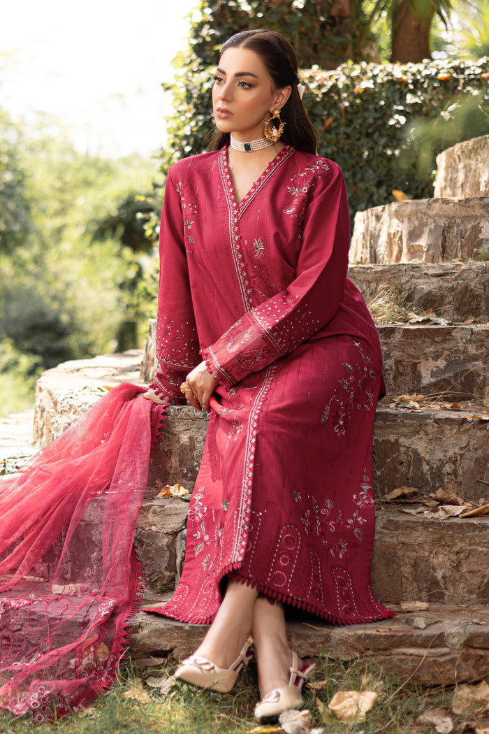 Sitting pose of NAQSHI garnet red outfit highlighting flowing dupatta and straight pants