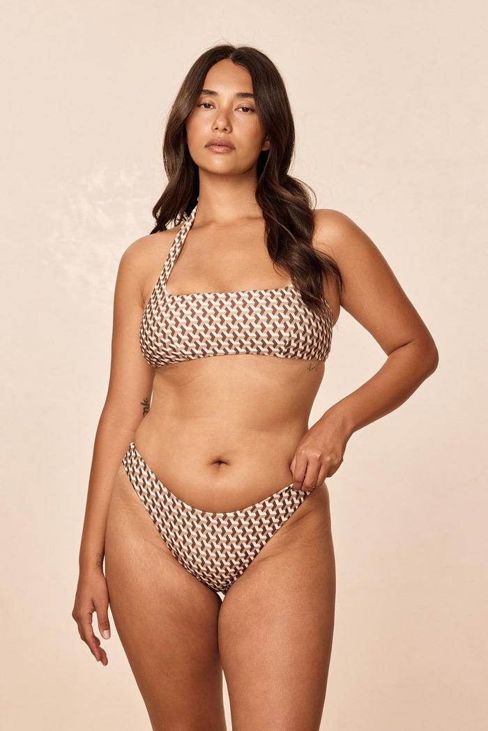 Front view of Amalfi Top in Husk Geo showcasing square neckline and adjustable halter strap on light beige background