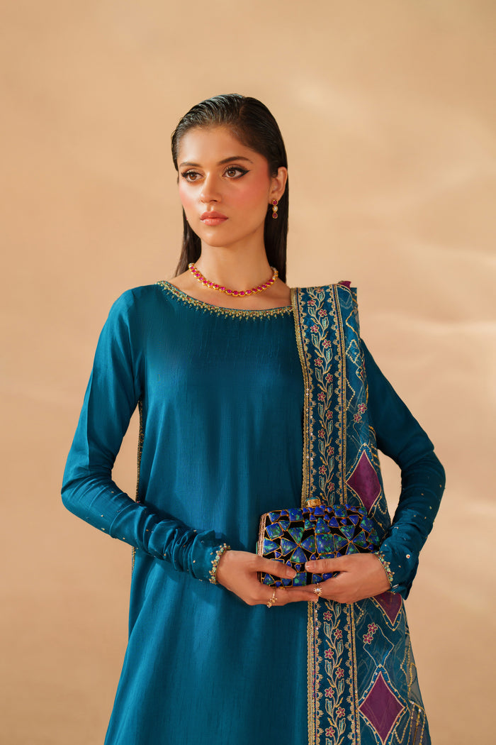 Close-up of NAQSHI Anaiza luxury pret outfit highlighting detailed adda work on boat neckline, raw silk fabric texture and matching organza dupatta