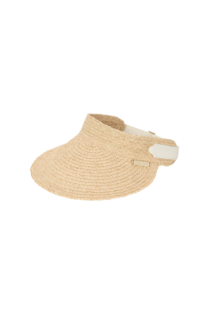 Close-up of Anguilla Visor in natural raffia showcasing 4.5 inch rounded brim, padded forehead, adjustable elastic back band and gold Monday logo on white background