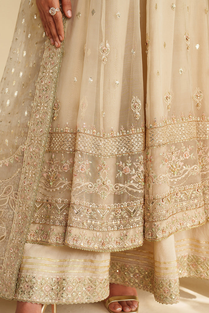 Close-up of Aroha dress detailed adda and sequin embroidery with elegant border work on organza fabric — festive and formal styling by NAQSHI