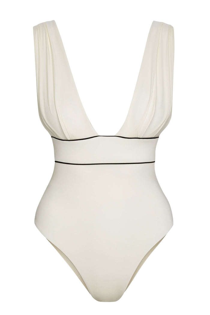 Front view of Aruba One Piece in ivory showing deep V neckline, supportive waist panel, wide shoulder straps and black piping on white background