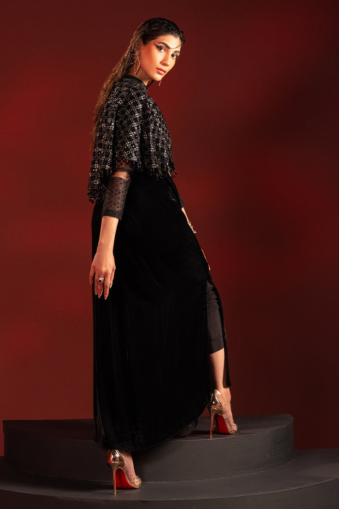 Side view of Ayna black velvet tunic showing clean straight fall and relaxed silhouette, elegant ready made formal party outfit.