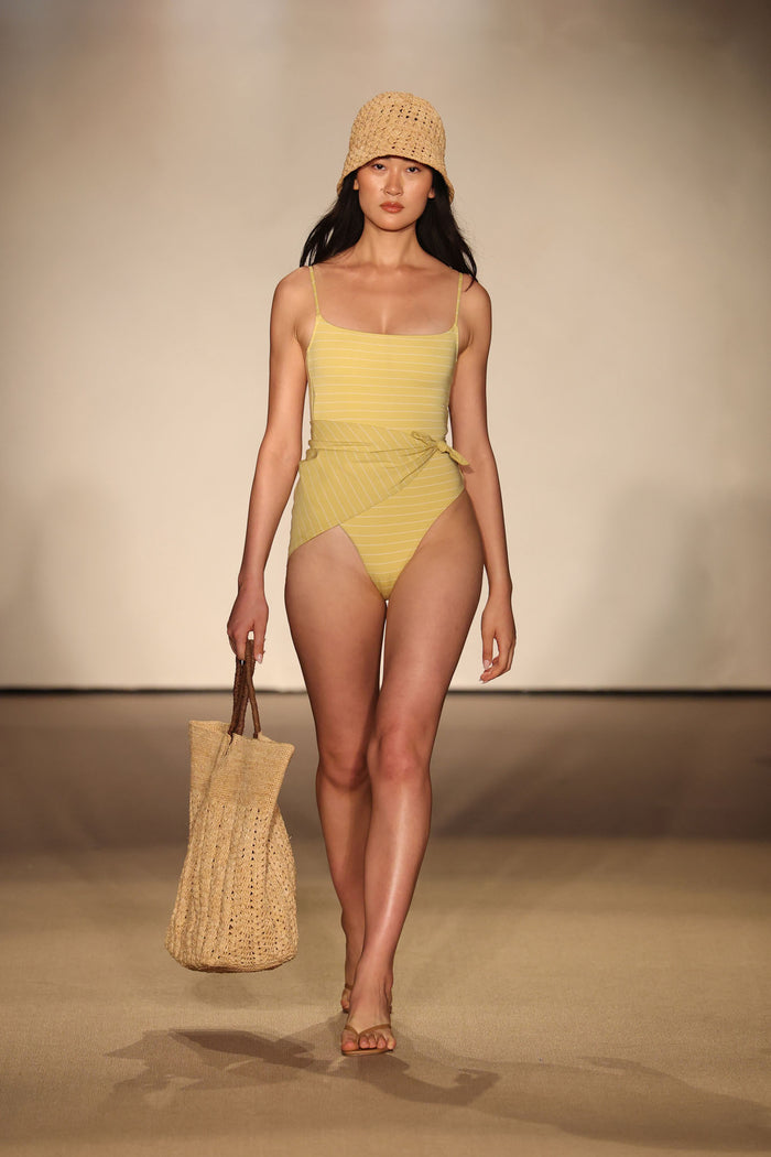 Front view of Bahamas One Piece - Meyer Stripe showcasing rounded neckline, high leg, wrap-tie waist on neutral runway