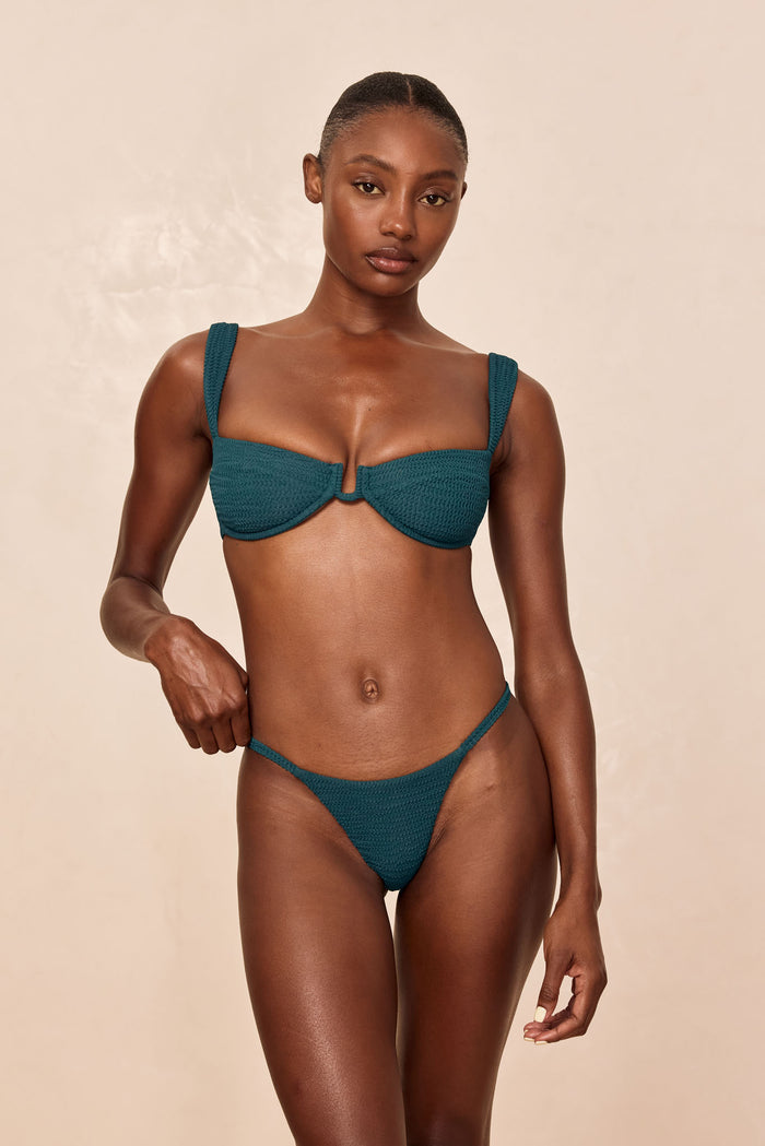 Front view of Barbados Bottom in Evergreen Crinkle on model showing textured crinkle fabric, high-cut leg and side straps