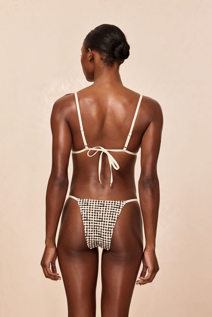 Back view of Barbados Top in Black Gingham with cream adjustable straps tied at center back and matching high cut bottoms
