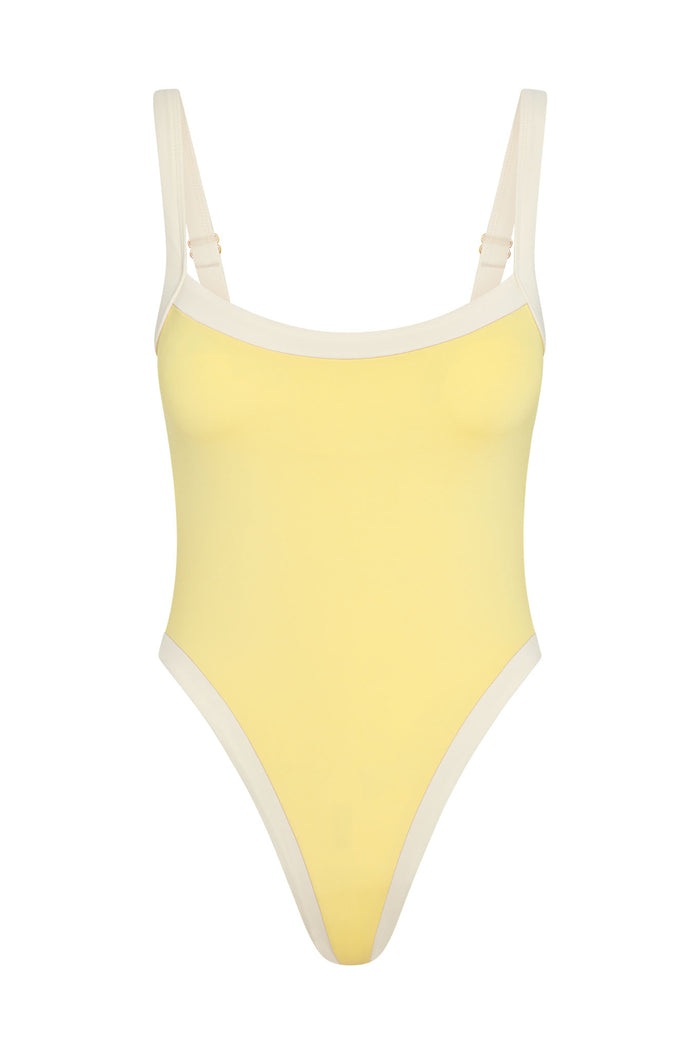 Front of Barcelona One Piece Meyer/Ivory showing yellow body with ivory trim, adjustable shoulder straps, shelf bra and high‑leg cheeky cut on white background
