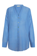 Front view of Barcelona Tunic in azure crinkle linen showcasing semi-sheer crinkle texture and mother-of-pearl button front on white background