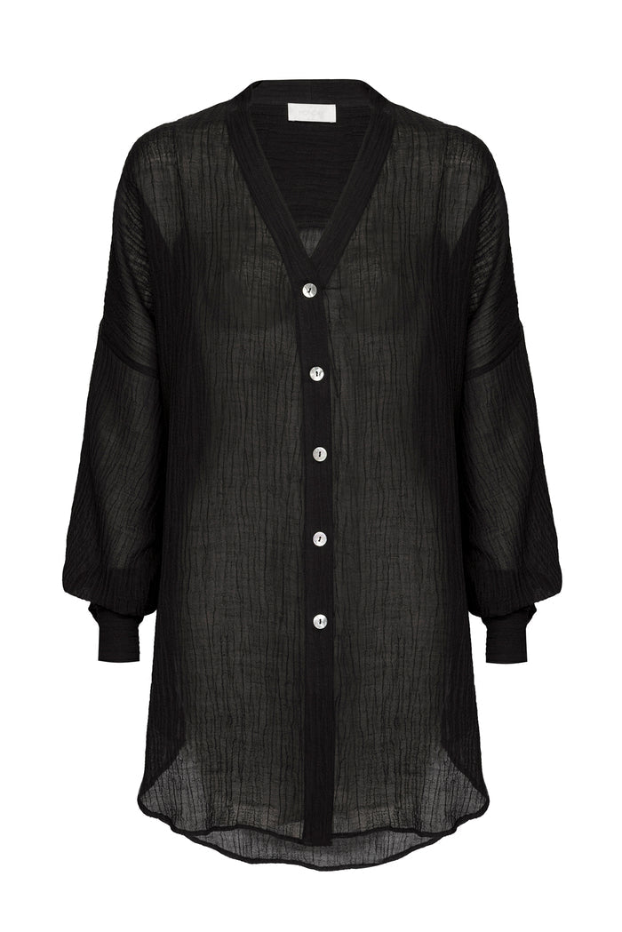 Front view of Barcelona Tunic in black crinkle linen showcasing sheer crinkled texture, V-neck, button-front and balloon sleeves on white background