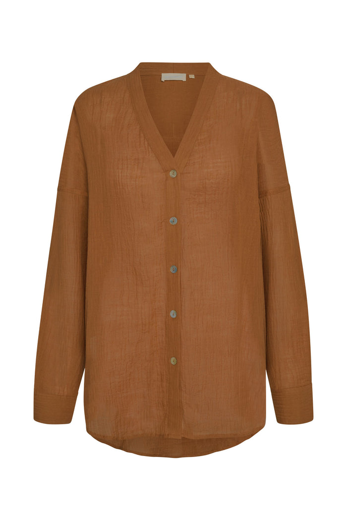 Front view of Barcelona Tunic in Caramel Crinkle Linen showcasing oversized fit, V-neck and seashell buttons on white background