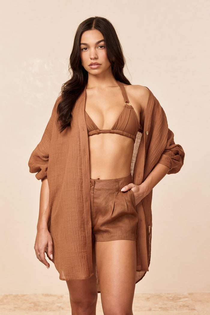 Front view of Barcelona Tunic in caramel crinkle linen showing oversized fit, seashell buttons and side slits