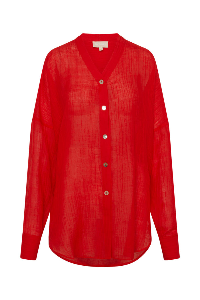 Front view of Barcelona Tunic in Chili Pepper crinkle linen showing sheer oversized fit, seashell buttons, long sleeves, and crinkle texture on white background