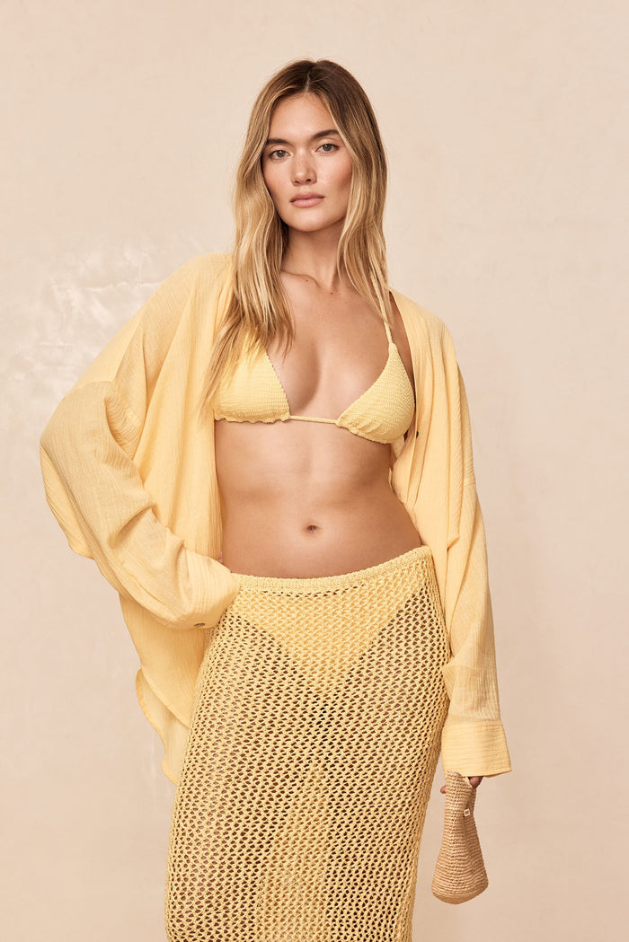 Front view of Barcelona tunic in Honey Crinkle showing oversized open-front fit and textured fabric on beige background
