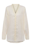 Front view of Barcelona Tunic in ivory linen showcasing V-neck, seashell buttons and long sleeves on white background