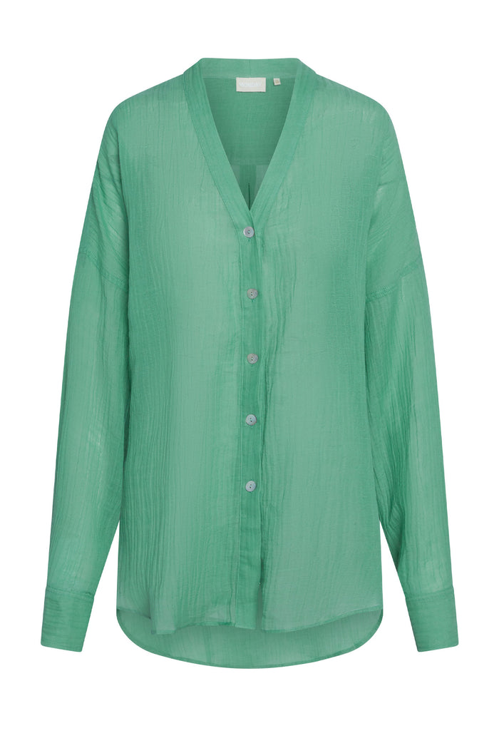 Sheer mint-green long-sleeve V-neck button-front blouse; inside label reads MONDAY