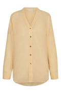 Front view of Barcelona Tunic in raffia crinkle linen, pale yellow, button-front V-neck with long sleeves on white background