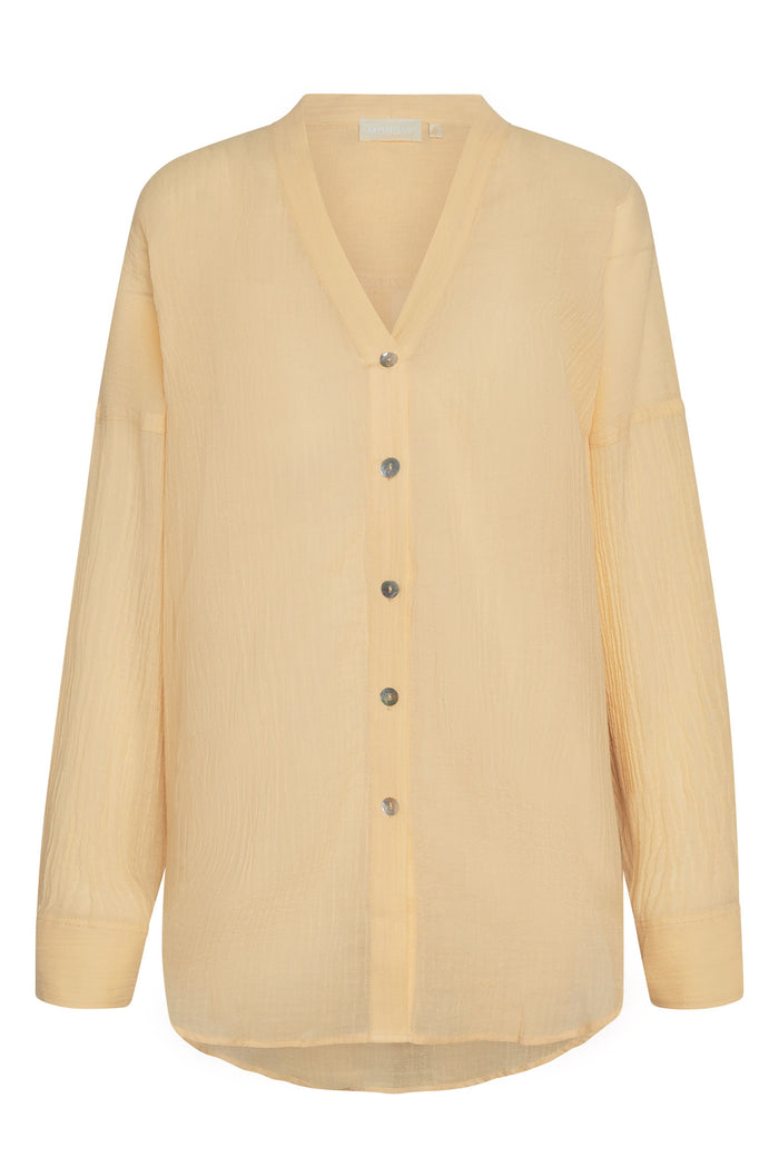 Front view of Barcelona Tunic in raffia crinkle linen, pale yellow, button-front V-neck with long sleeves on white background