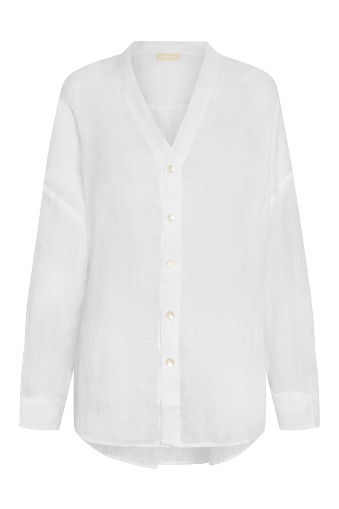Front view of Barcelona Tunic in white linen showcasing V-neck, button front with mother-of-pearl buttons and long sleeves on white background