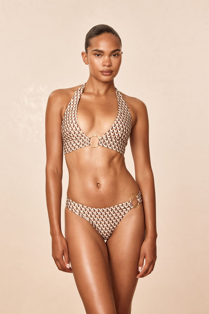 Front view of Bari Bottom Husk Geo showcasing brown geo print and gold ring hip detail against beige backdrop