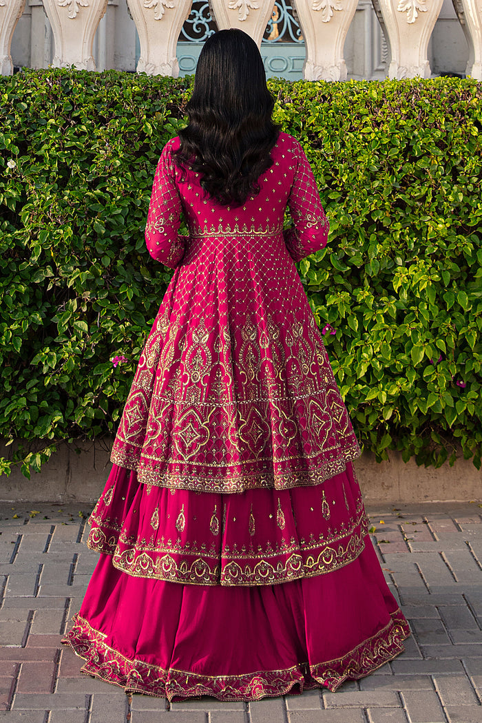 Macro view of Behnaam frock bodice highlighting dense hand‑adda embroidery, sequin threadwork, lace detailing, and V-neck embellishments.