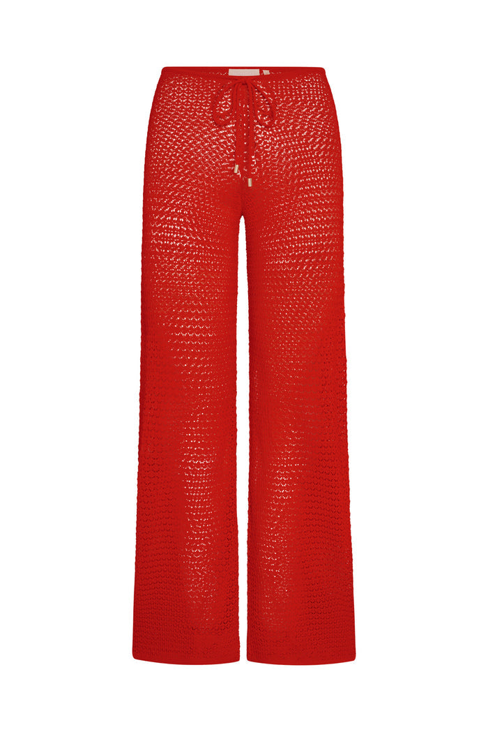 Front view of Belize Knit Pant in Chili Pepper showing open knit crochet, drawstring waist, sheer fabric on white background