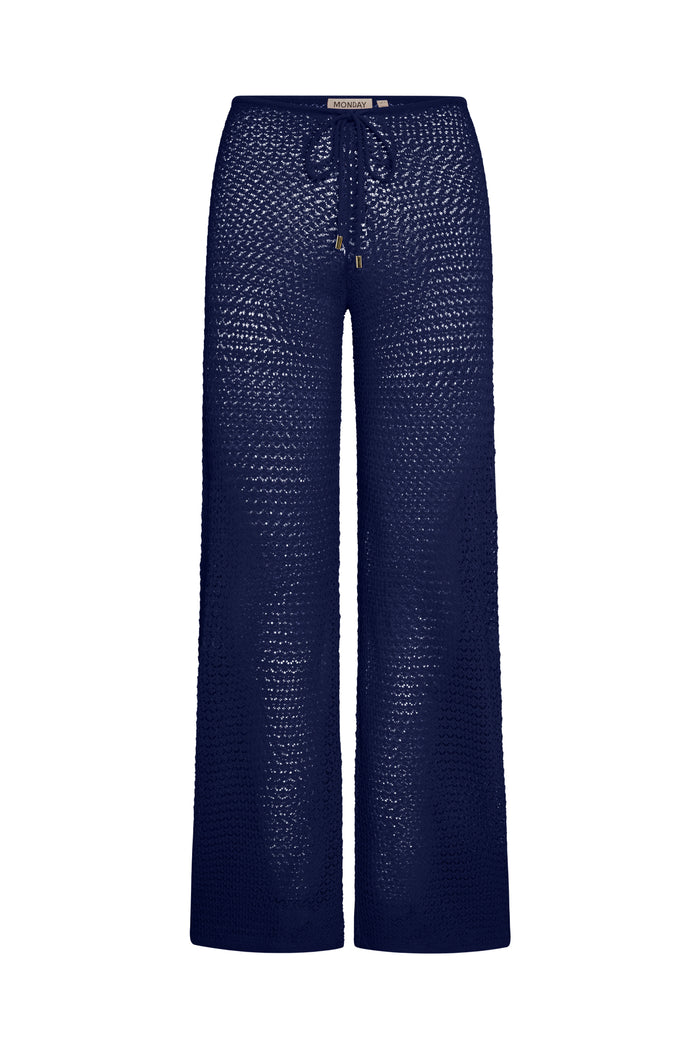 Front view of Belize Knit Pant in midnight showing open crochet knit, drawstring waist, and wide leg on white background