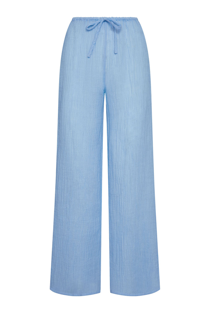 Front view of Belize Pant in Sky Crinkle linen with wide-leg silhouette and adjustable drawstring waist on white