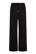 Front view of Belize Pant open-knit in black showing wide-leg silhouette and drawstring waist with gold aglets on white