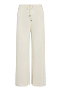 Front view of Belize Pant Open Knit in ivory showcasing open-knit wide-leg silhouette and drawstring waist with metal-tipped cords on white background