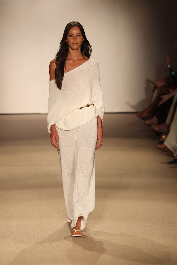 Front view of Belize Pant Open Knit in ivory showcasing sheer open-knit wide-leg pants with elastic drawstring waist on runway