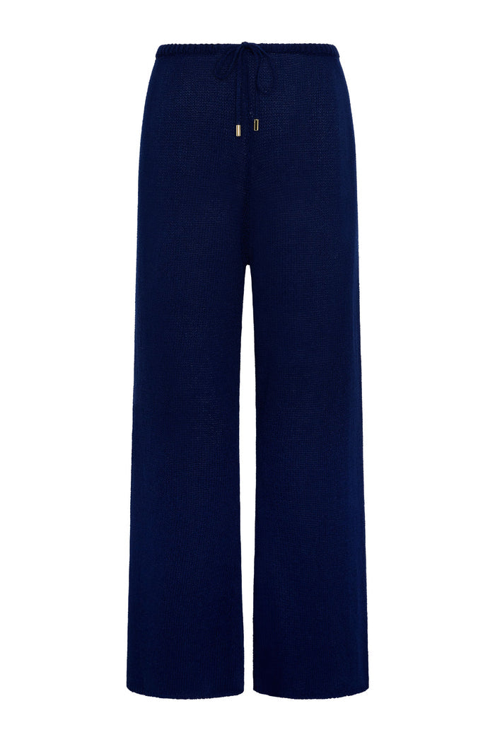 Navy wide-leg knit pants with elastic drawstring waist and gold-tipped cords